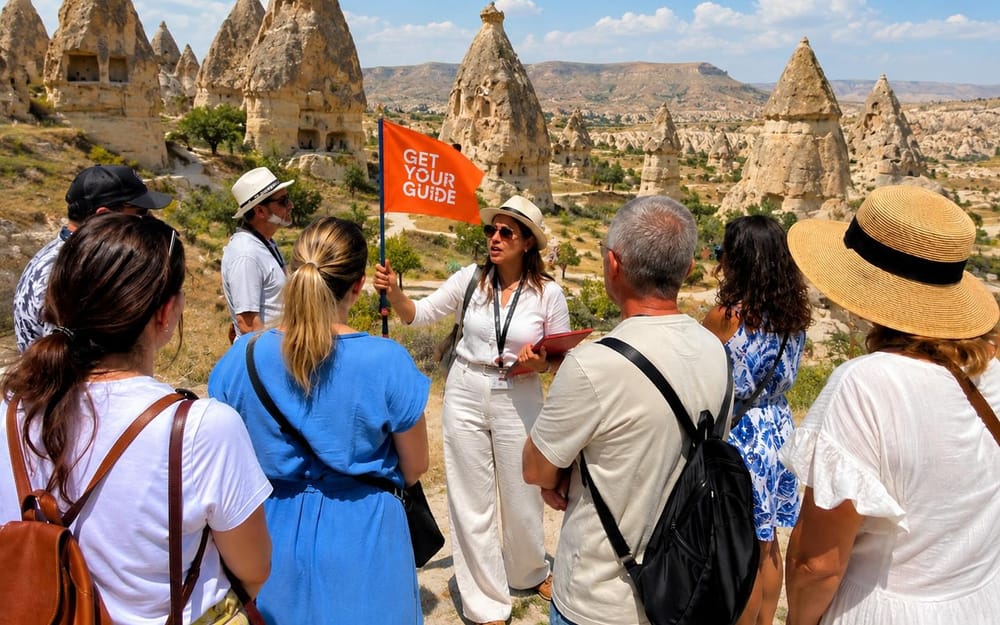 A guided group exploring Cappadocia’s fairy chimneys