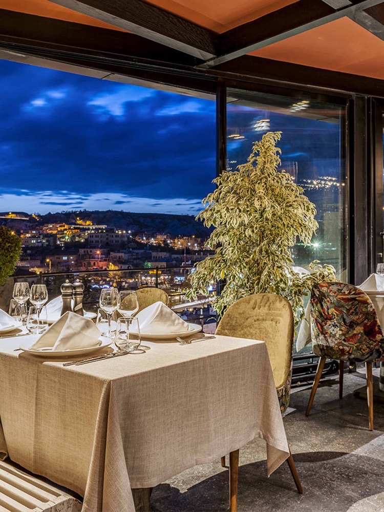 Dining table overlooking Göreme at Carus Cappadocia