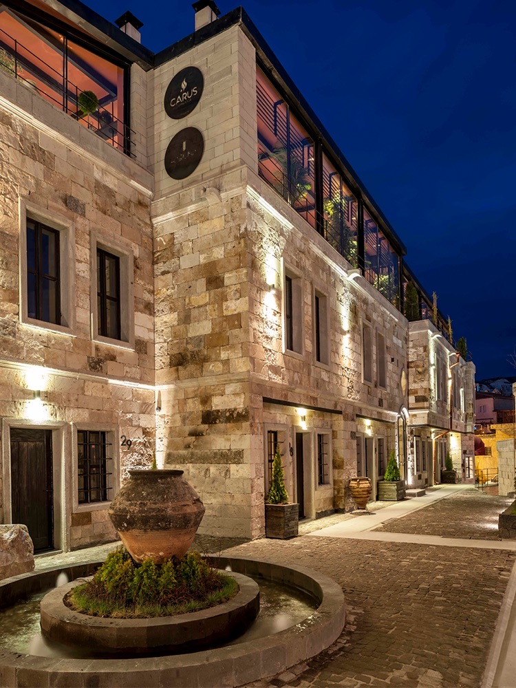 Illuminated stone courtyard and fountain at Carus Cappadocia